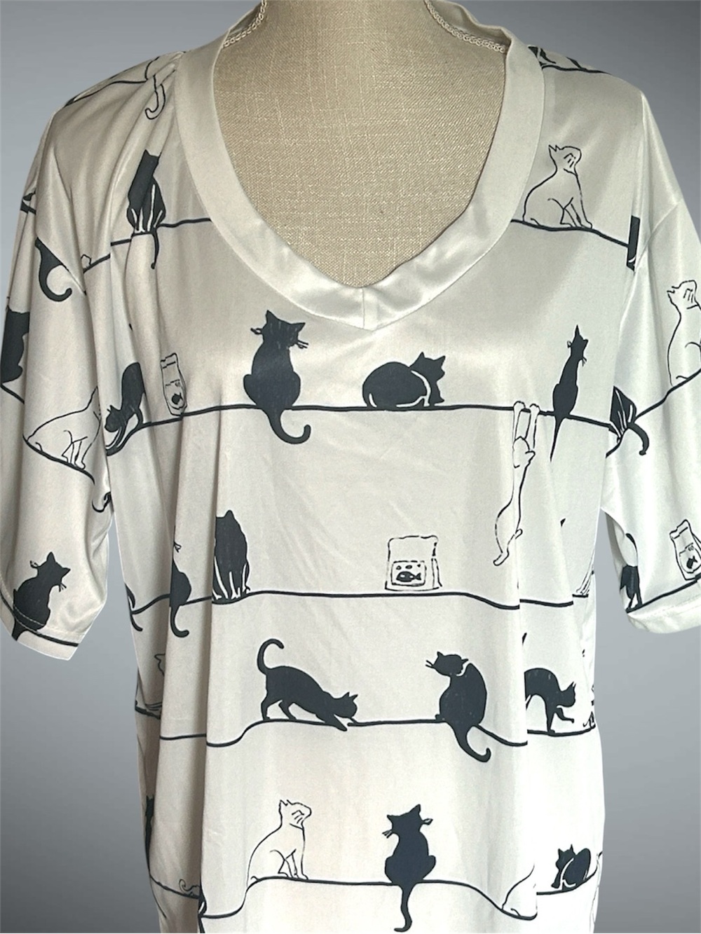 Cat print shirt featuring an all-over pattern of black & white silhouette cats